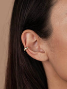 Gold Ribbed Cuff Earring worn on mid ear