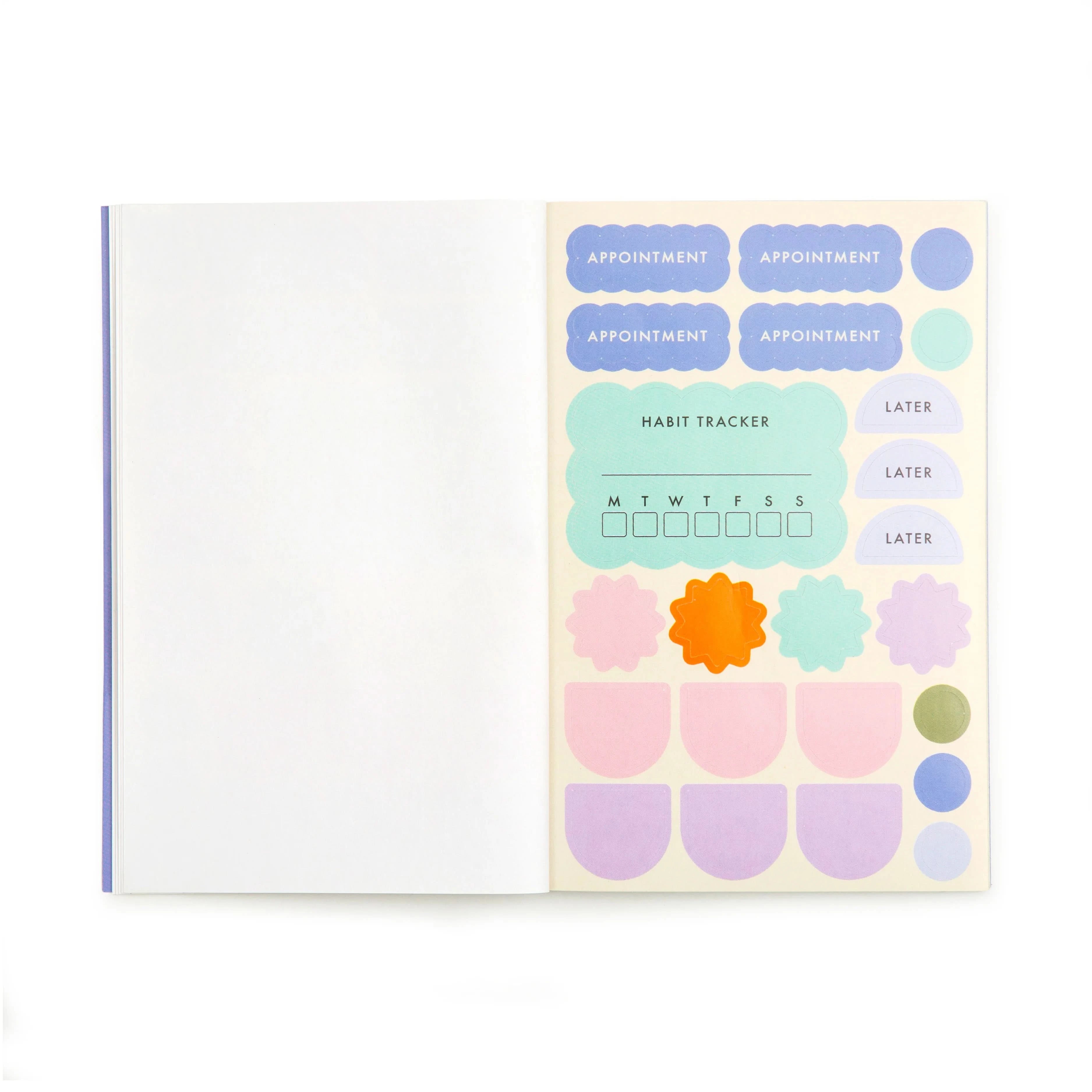 Open booklet of colorful stickers for planner