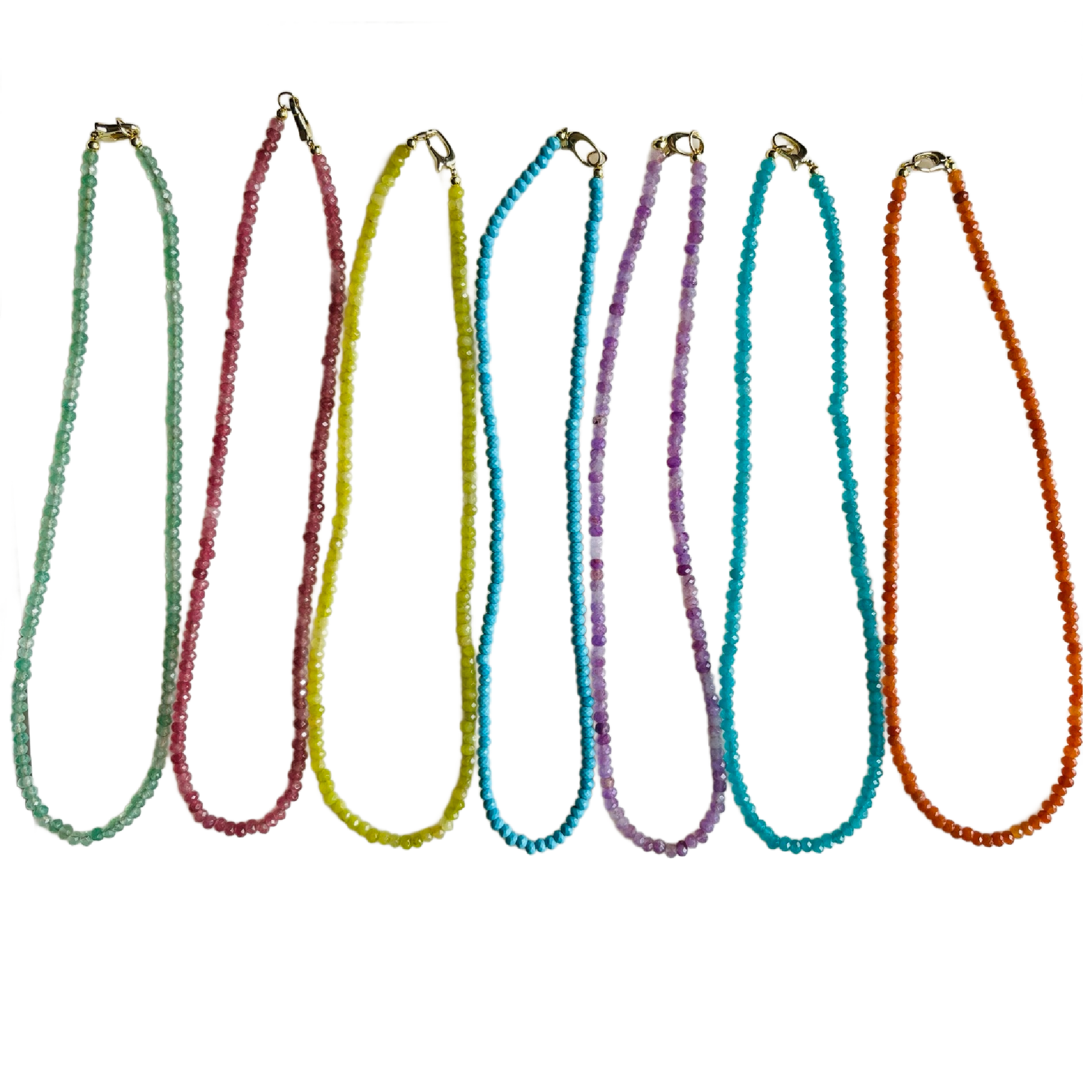 Set of colorful beaded necklaces on a white background