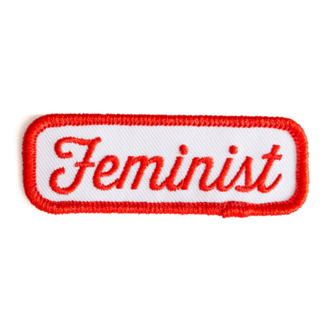 Embroidered patch with 'Feminist' text on a white background