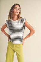 model wearing black and white striped cotton short sleeve top with a structured shoulders