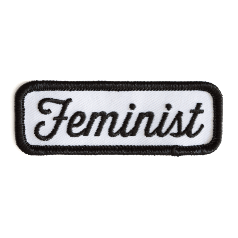 Embroidered patch with the word 'Feminist' on a white background