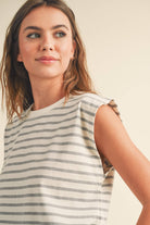 model wearing gray and white striped cotton short sleeve top with a structured shoulders