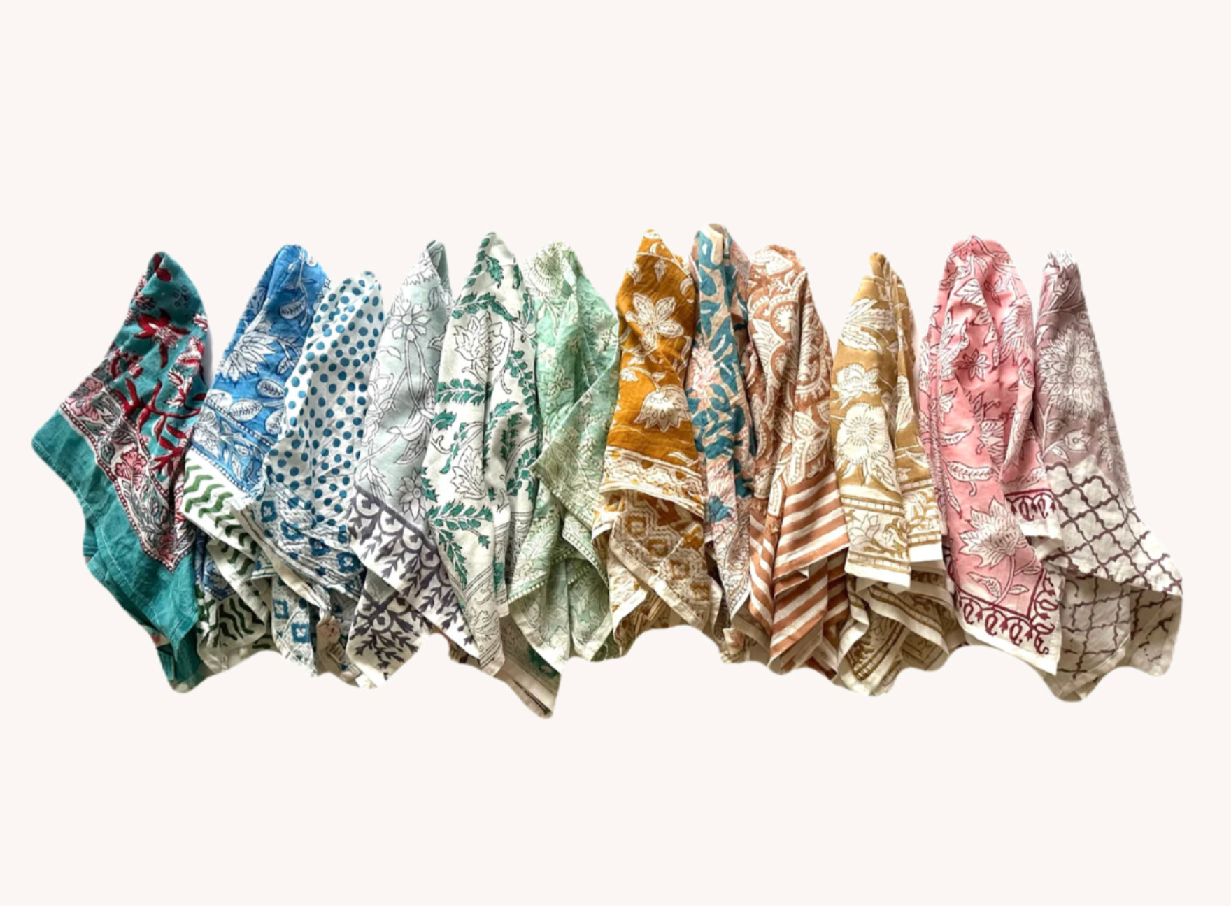 Row of patterned scarves in various colors on a white background