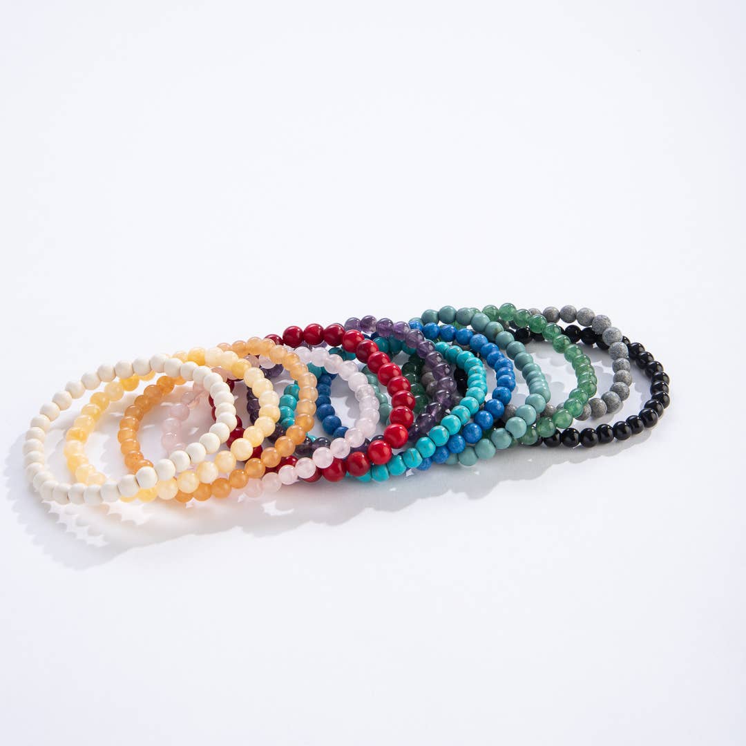 Set of colorful beaded bracelets on a white background