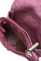 Inside look at the Fuschia pink Rough suede material leather wallet with flap and  button clasp