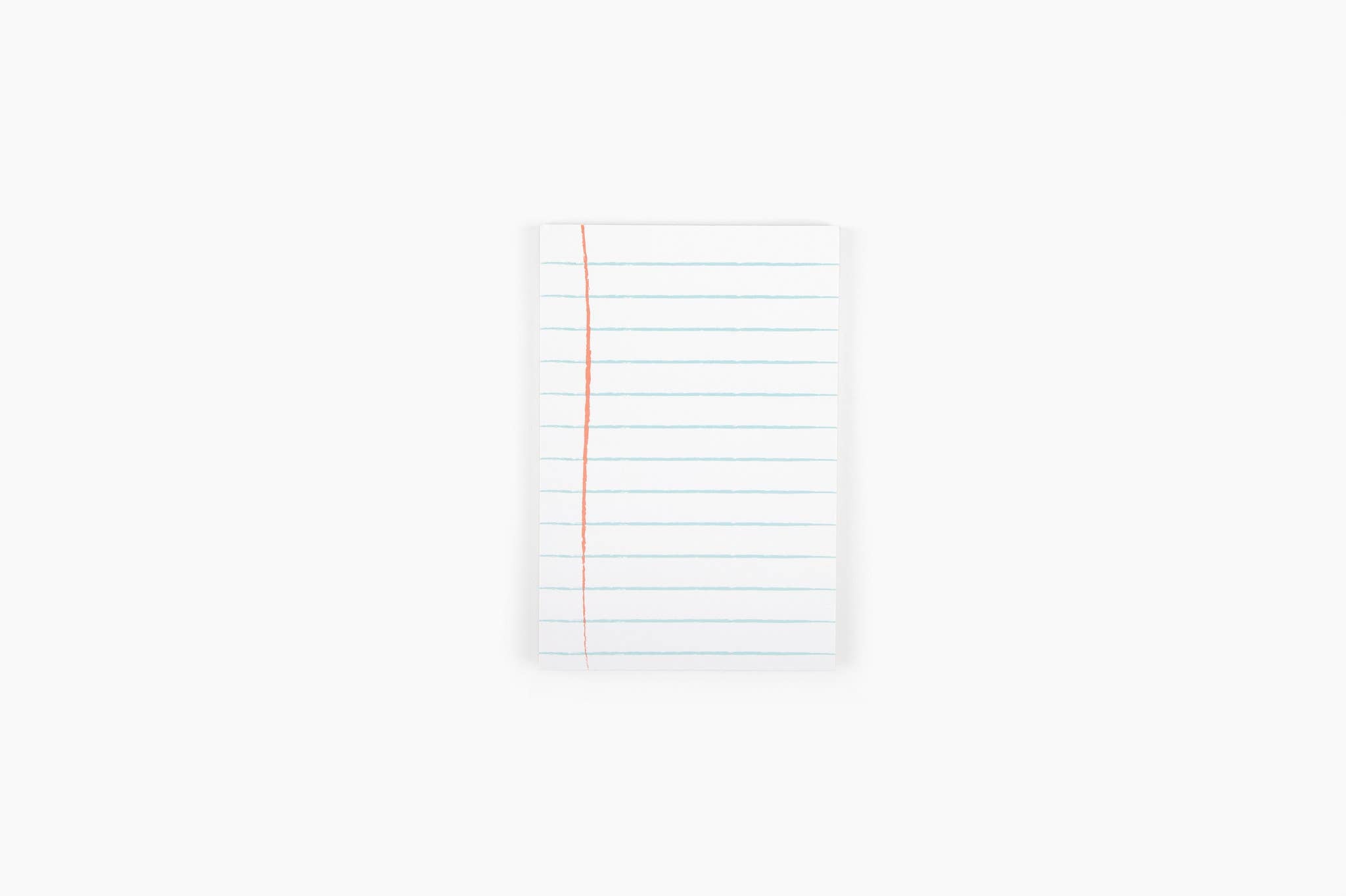 White notebook with grid lines on a white background