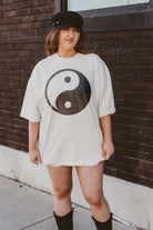 woman wearing hand printed t-shirt with distressed boho Yin-yang design