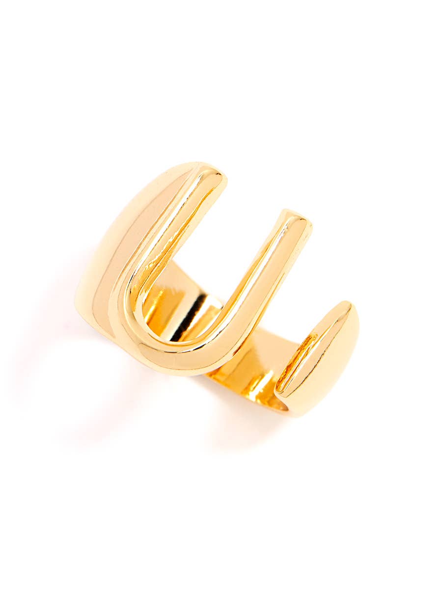 Gold adjustable letter ring on white background in letter U