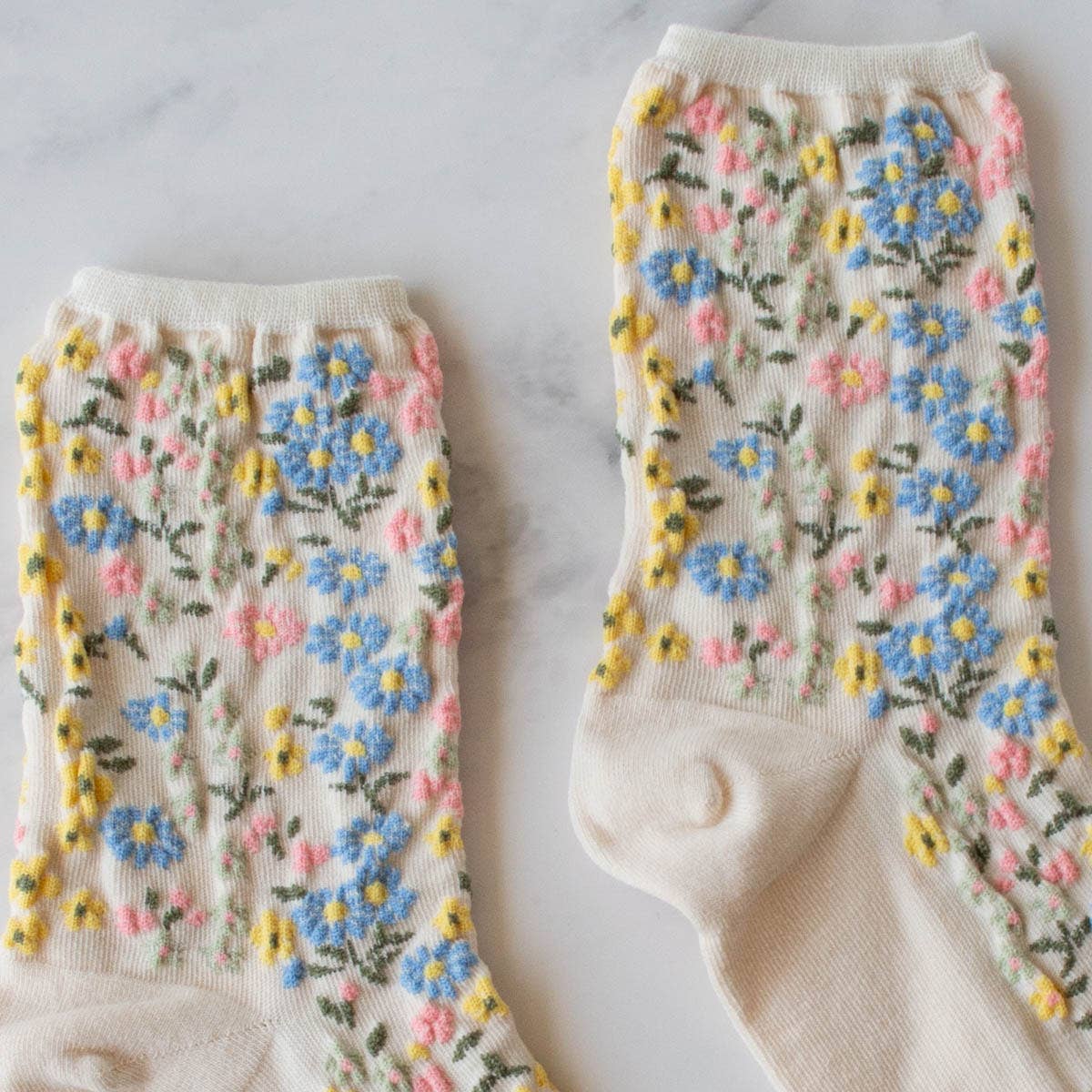 romantic floral socks with white, blue yellow, and pink