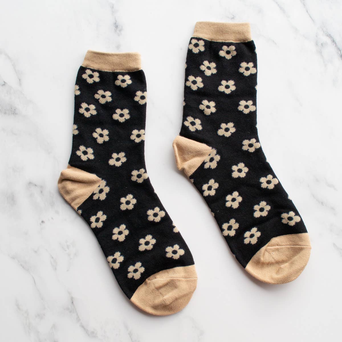 black socks with tan doodled flowers and accents 