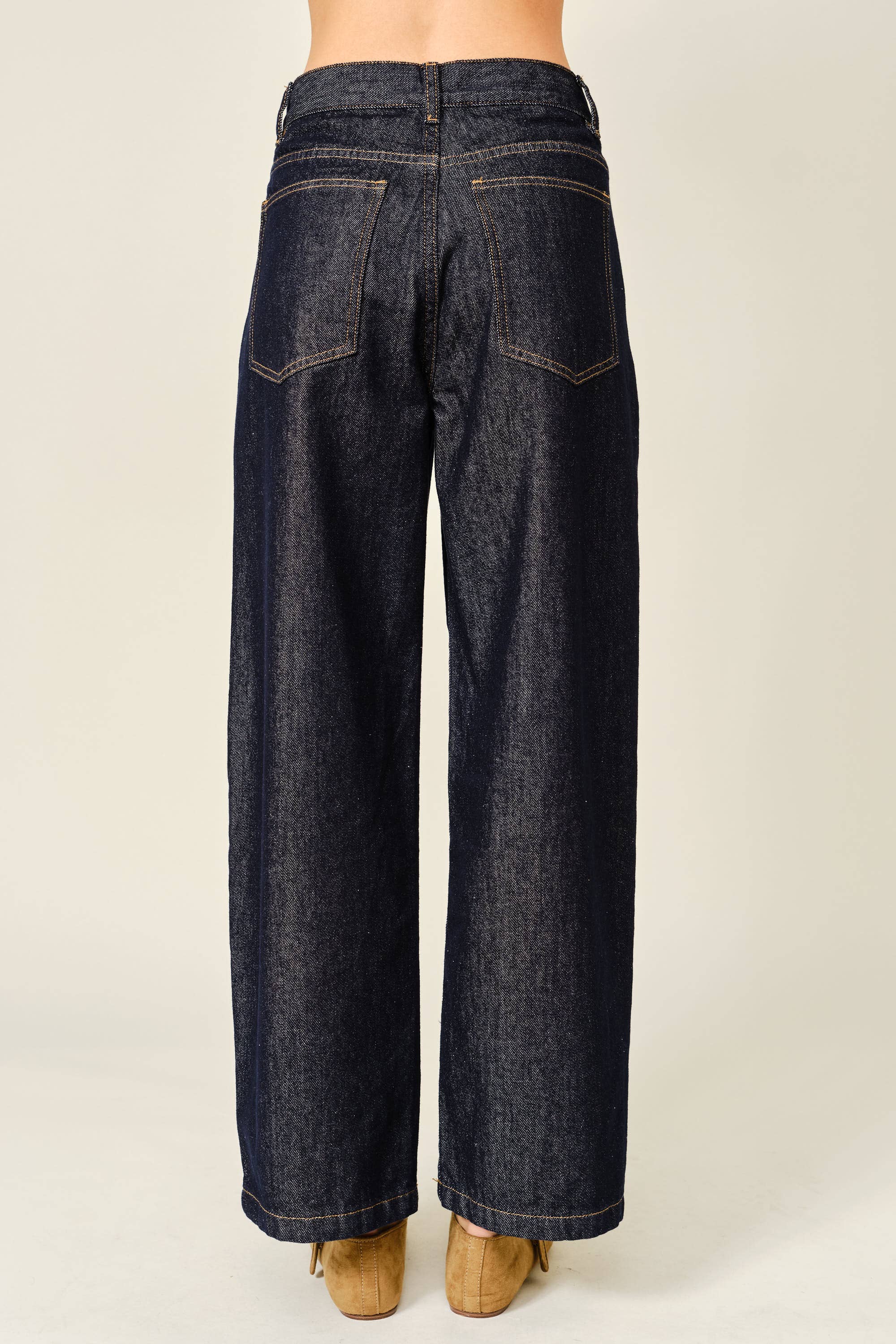 Dark blue wide-leg jeans on a plain background