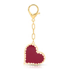 Hand painted enamel red heart bag charm with scalloped white and gold outline detail with gold chain and big lobster clip 