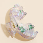 Lavender hair claw laying on its side