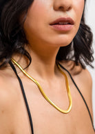Woman wearing 18k gold 15inch to 17 inch herringbone necklace 