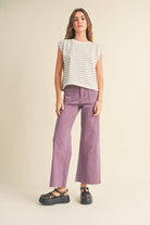 model wearing gray and white striped cotton short sleeve top with a structured shoulders