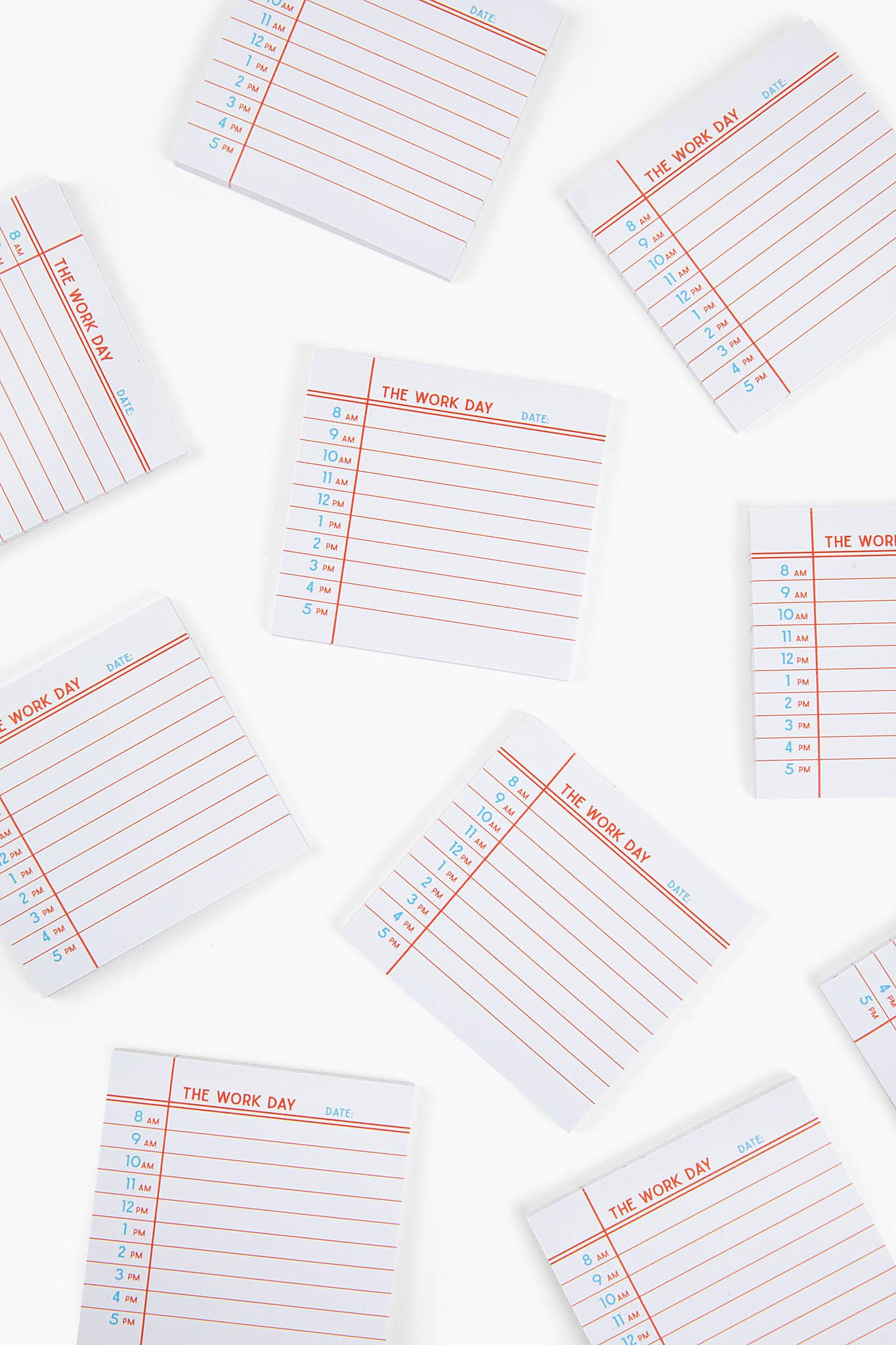 Multiple small pads of paper titled 'The Work Day' on a white background