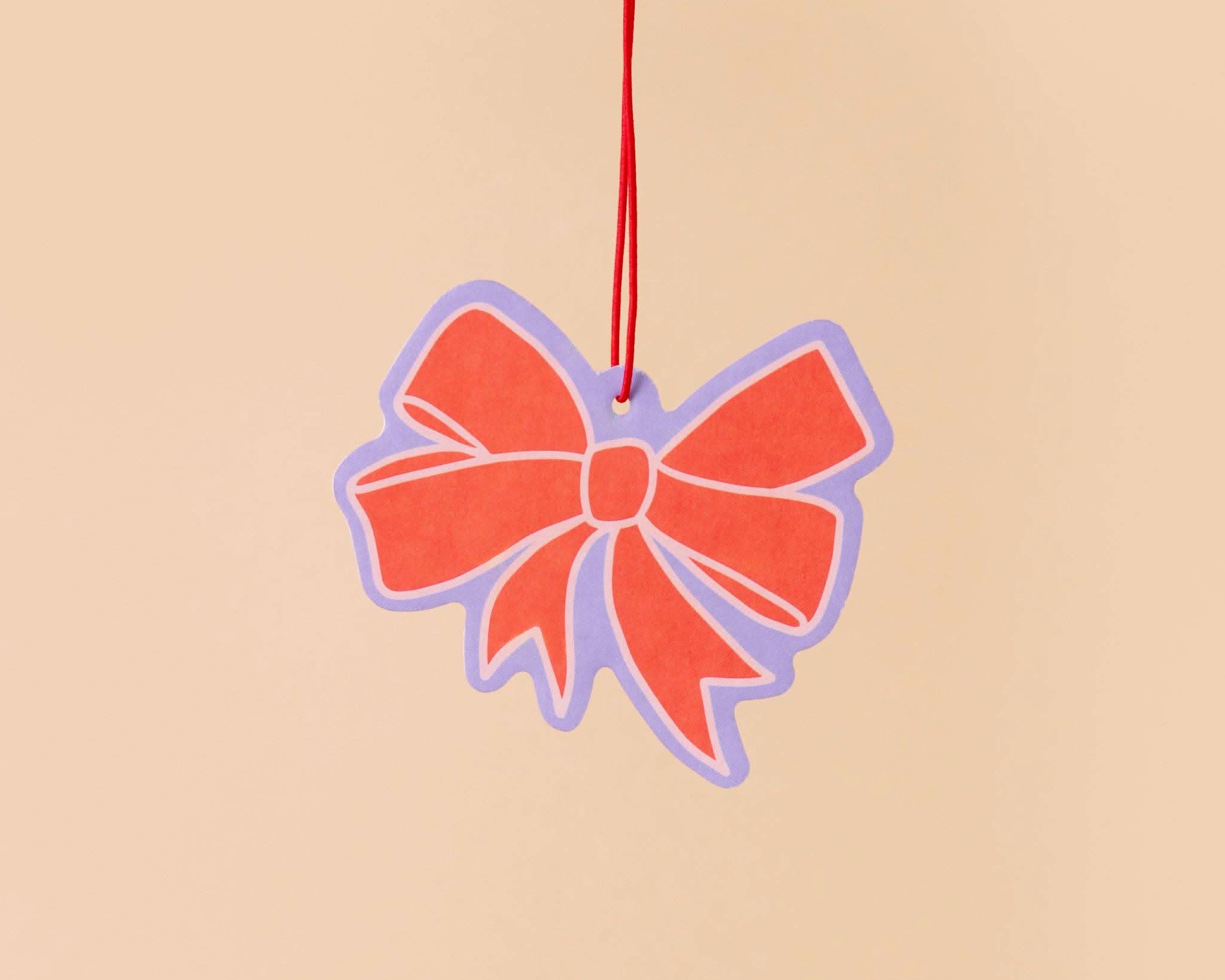red bow car air freshener with lavender and pink details