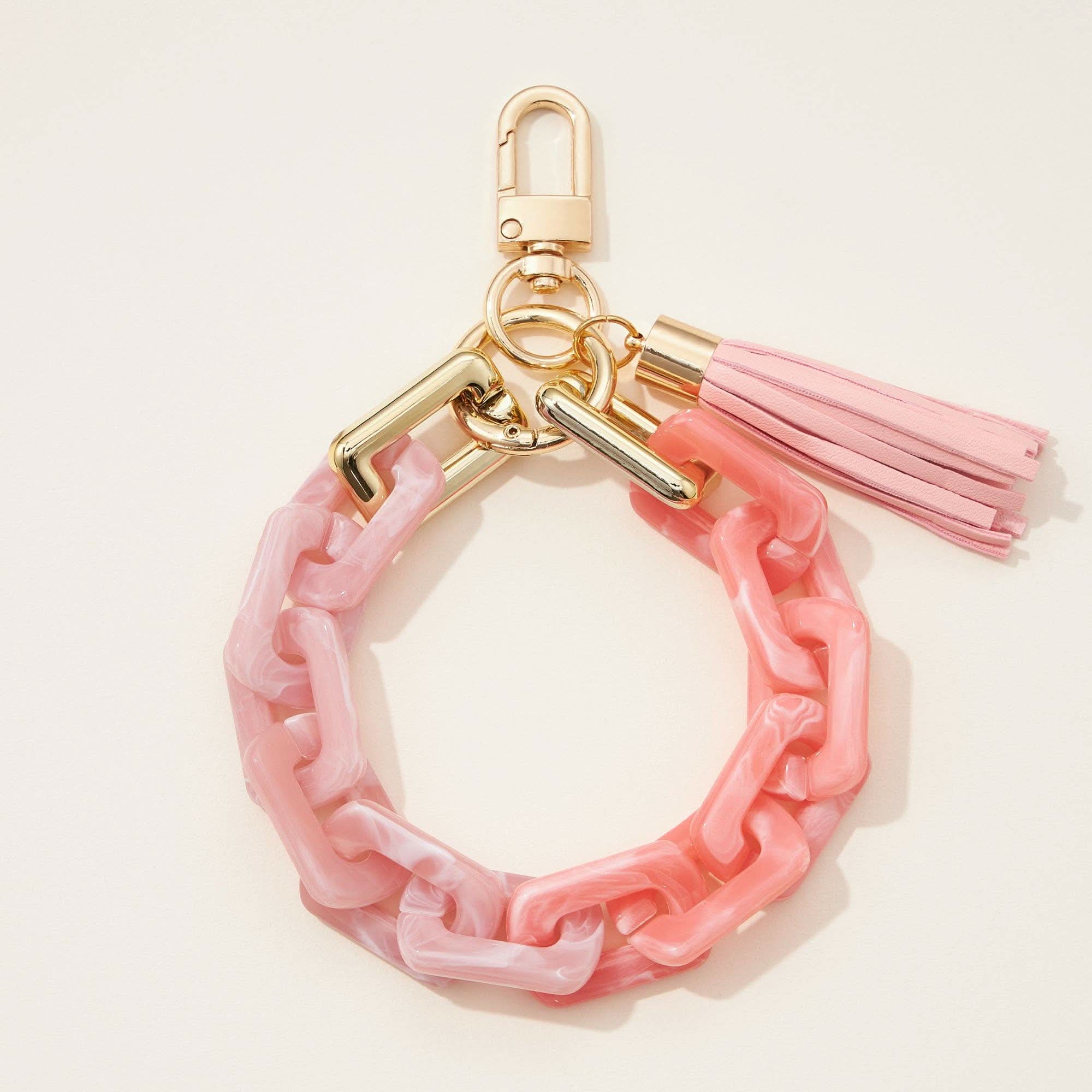 Two toned pink thick chain keychain with pink tassel and gold clip details