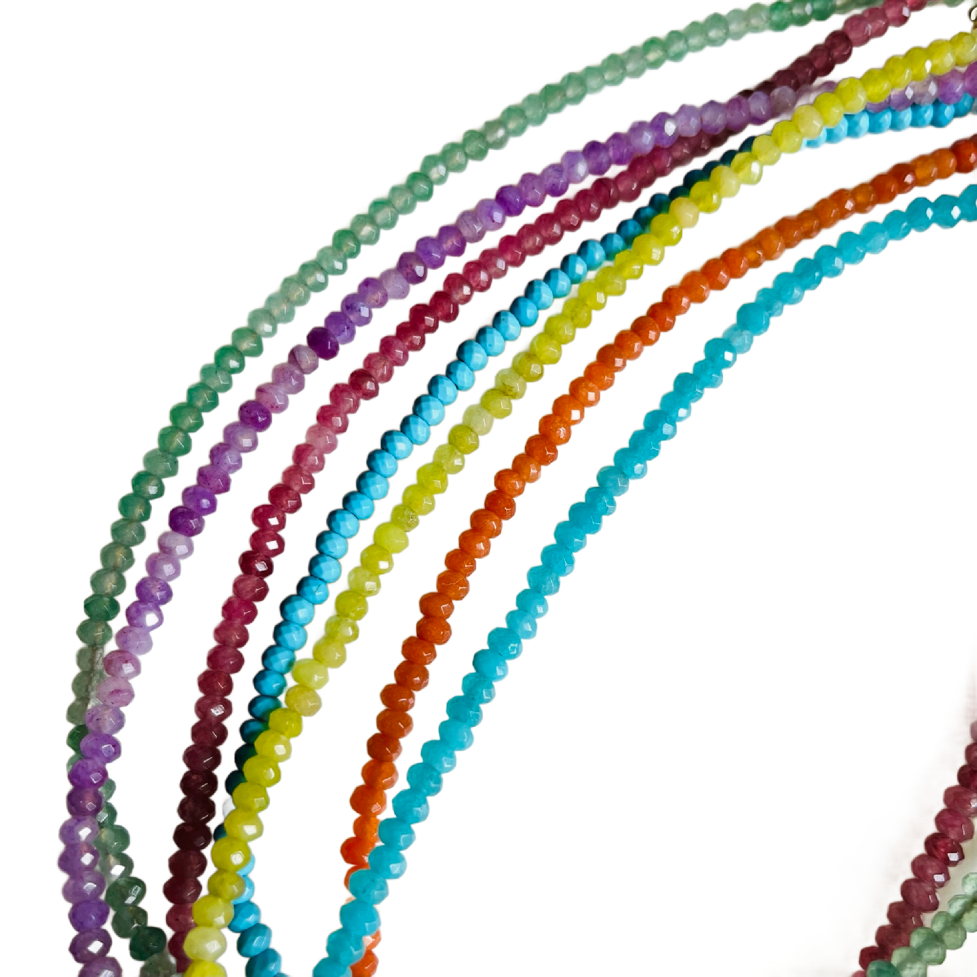 Set of colorful beaded strands on a white background