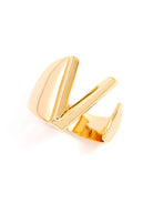 Gold adjustable letter ring on white background in letter V