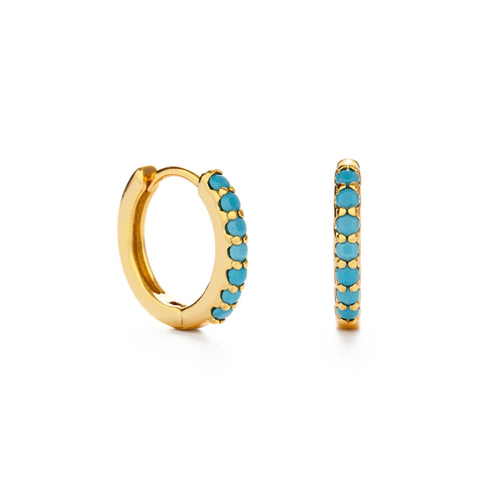 Gold hoop earrings with turquoise stones on a white background