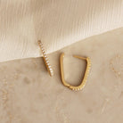 Gold hoop earrings lined with CZ detail shown opened 