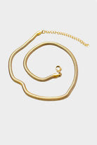 18k gold 15 inch to 17 inch herringbone necklace laid out in a swirl pattern on white background 