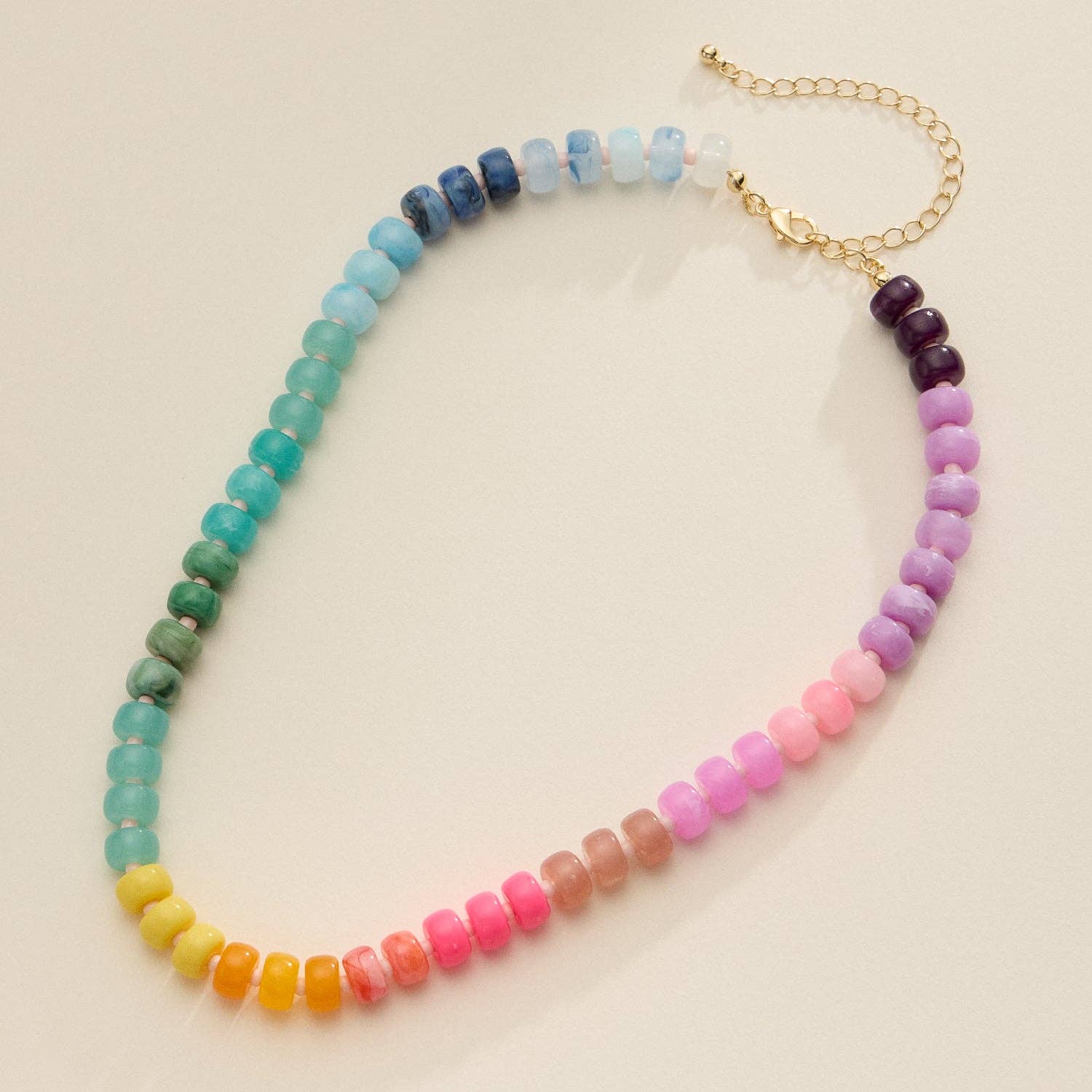 Rainbow colored beaded necklace with gold clasp