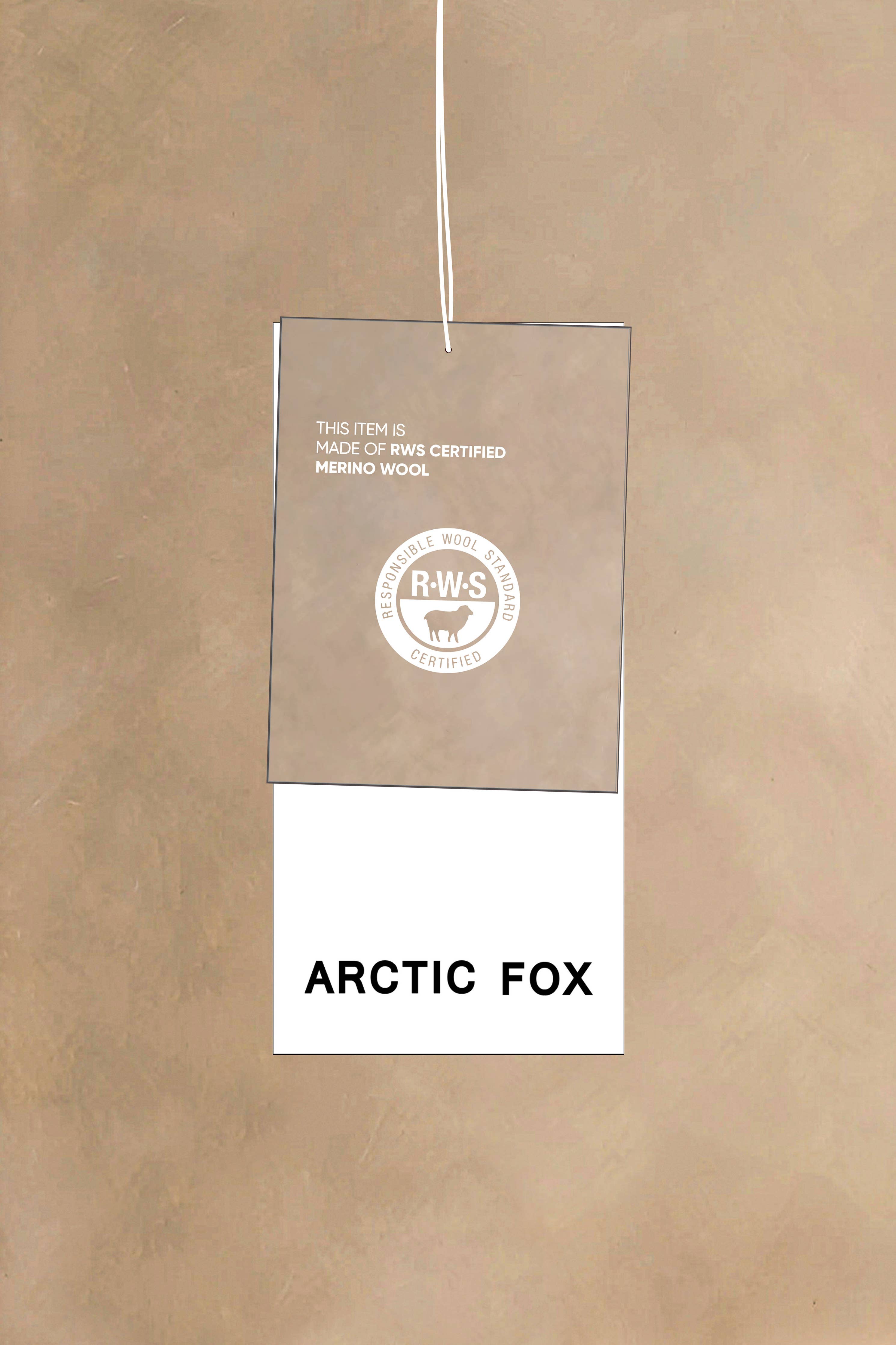 Product tag with 'Arctic Fox' text and a logo on a beige background