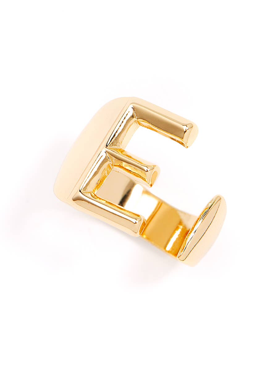 Gold adjustable letter ring on white background in letter E