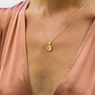 wearing Polaris the north star crystal stone gold necklace