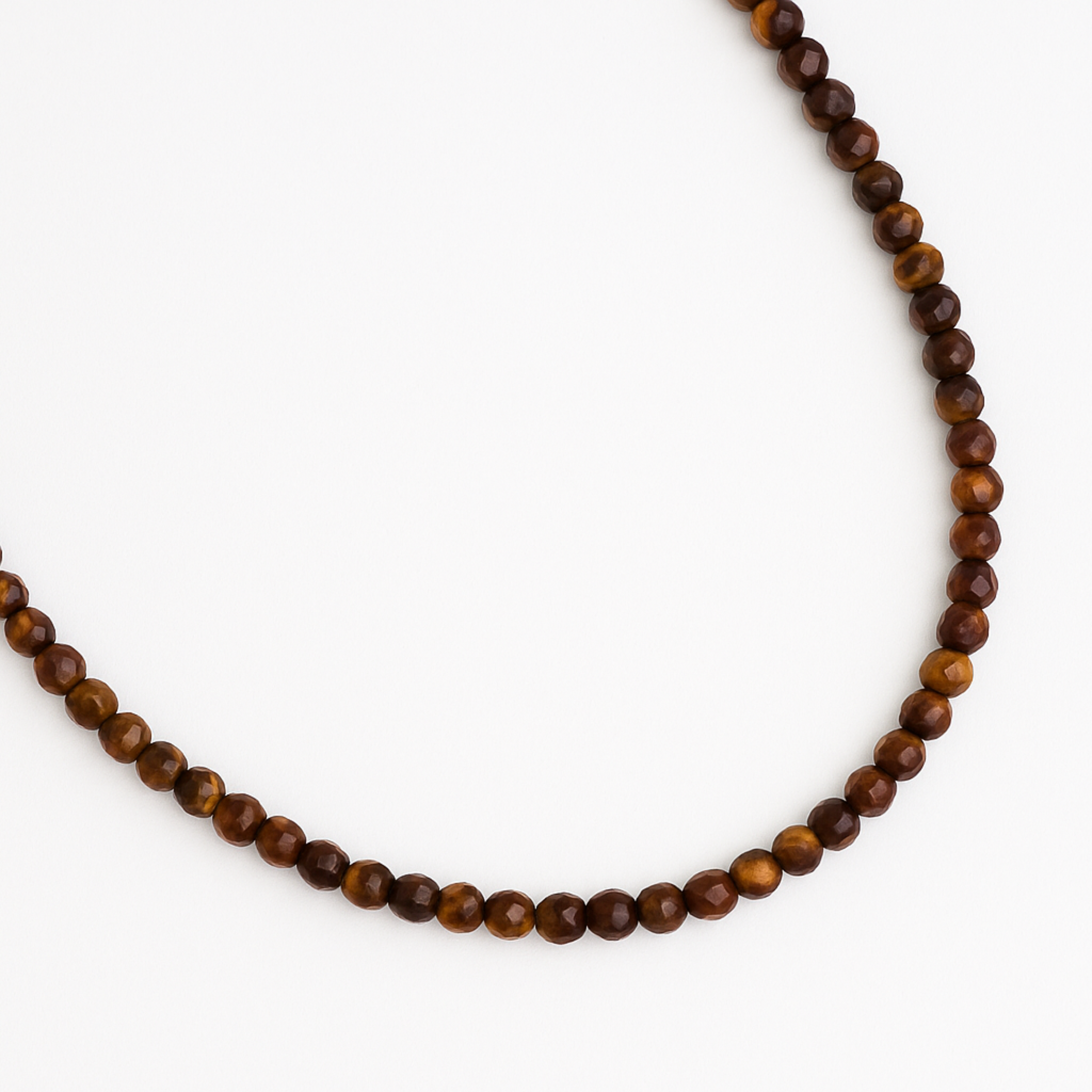 Beaded necklace with brown beads on a white background