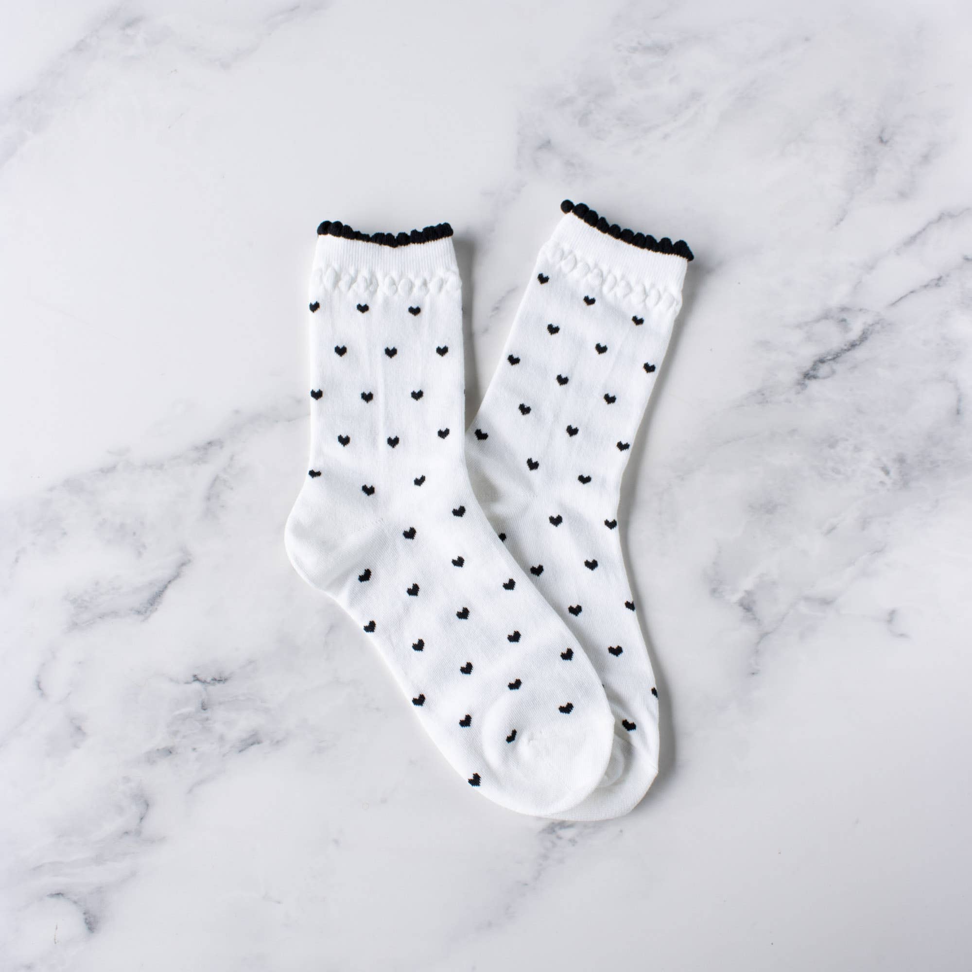 white lettuce trim socks with mini black hearts 