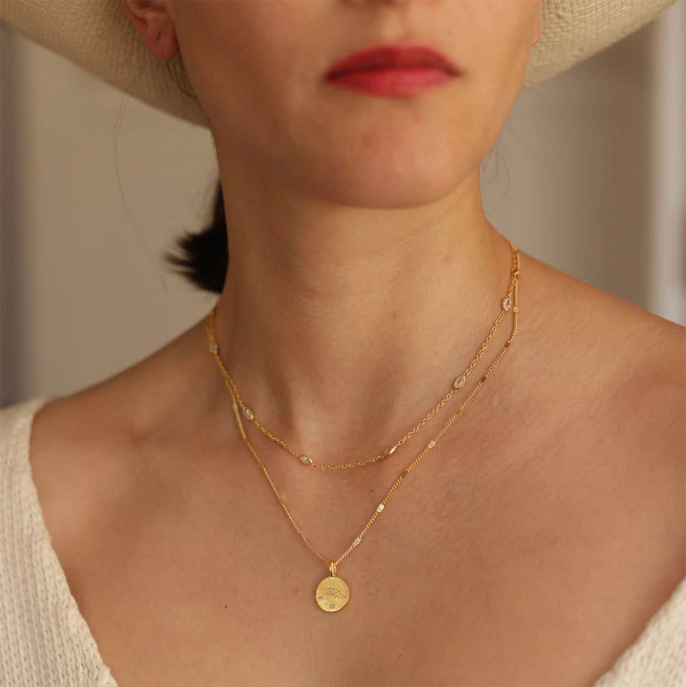 crystal stone eye of protection necklace in gold jewelry stack