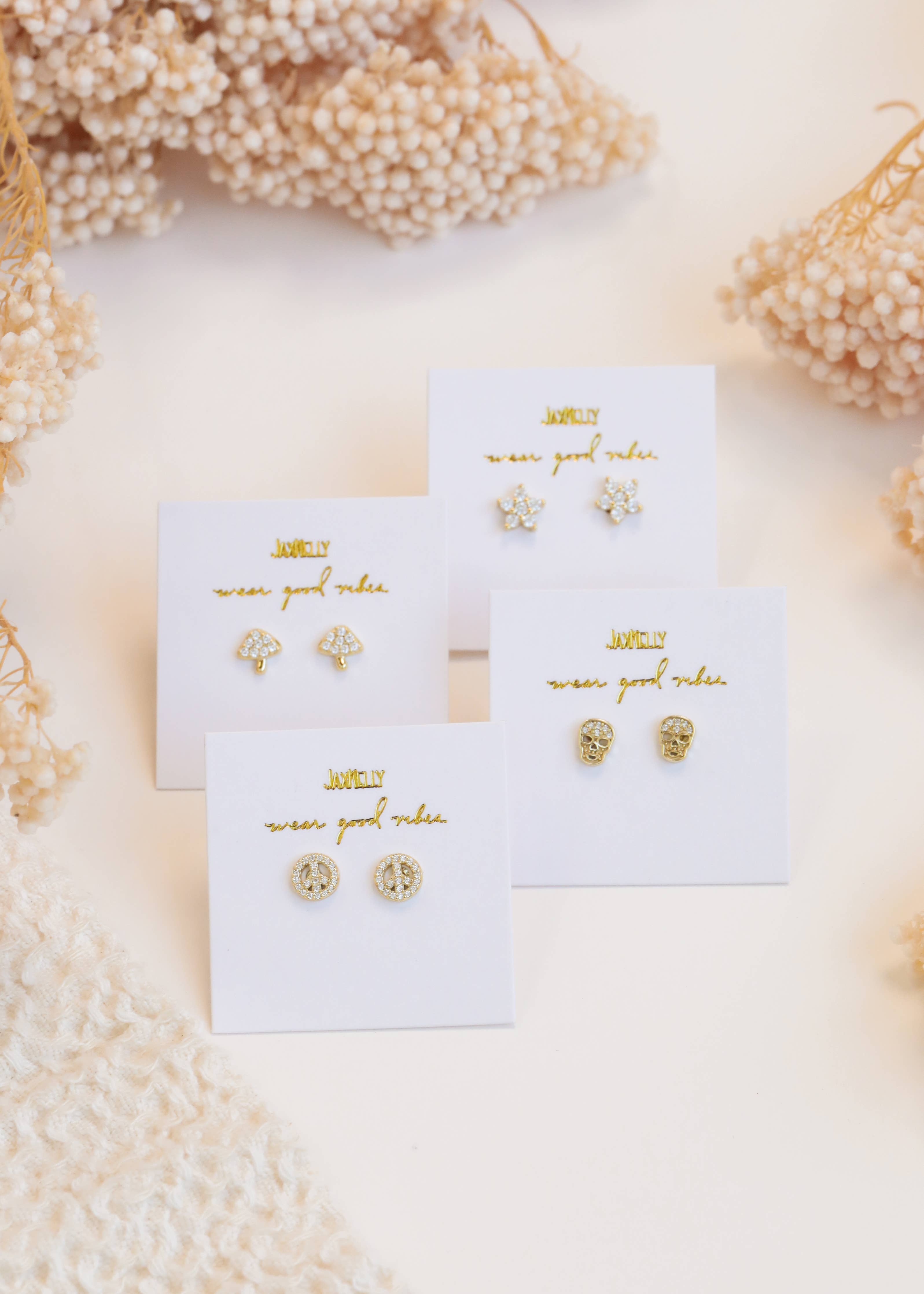 four different pave stud earrings 