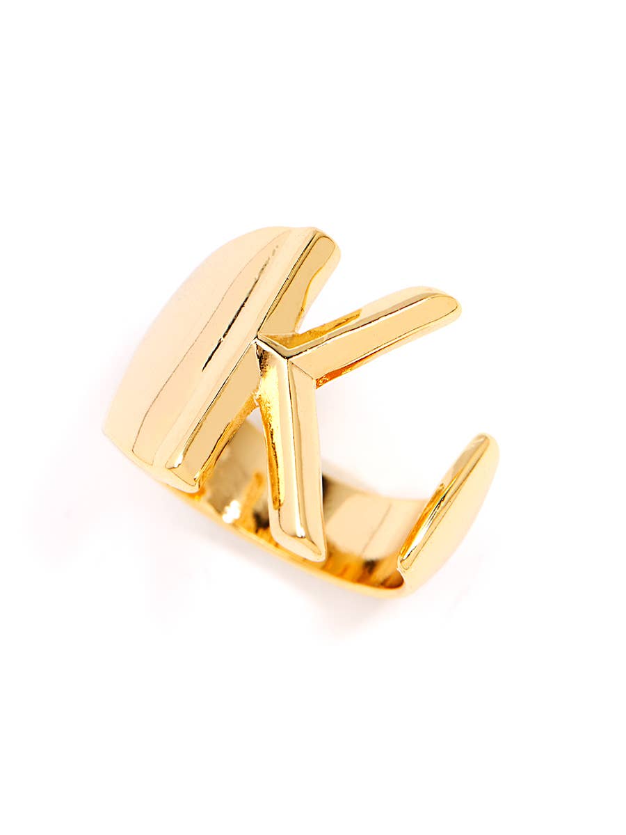 Gold adjustable letter ring on white background in letter K