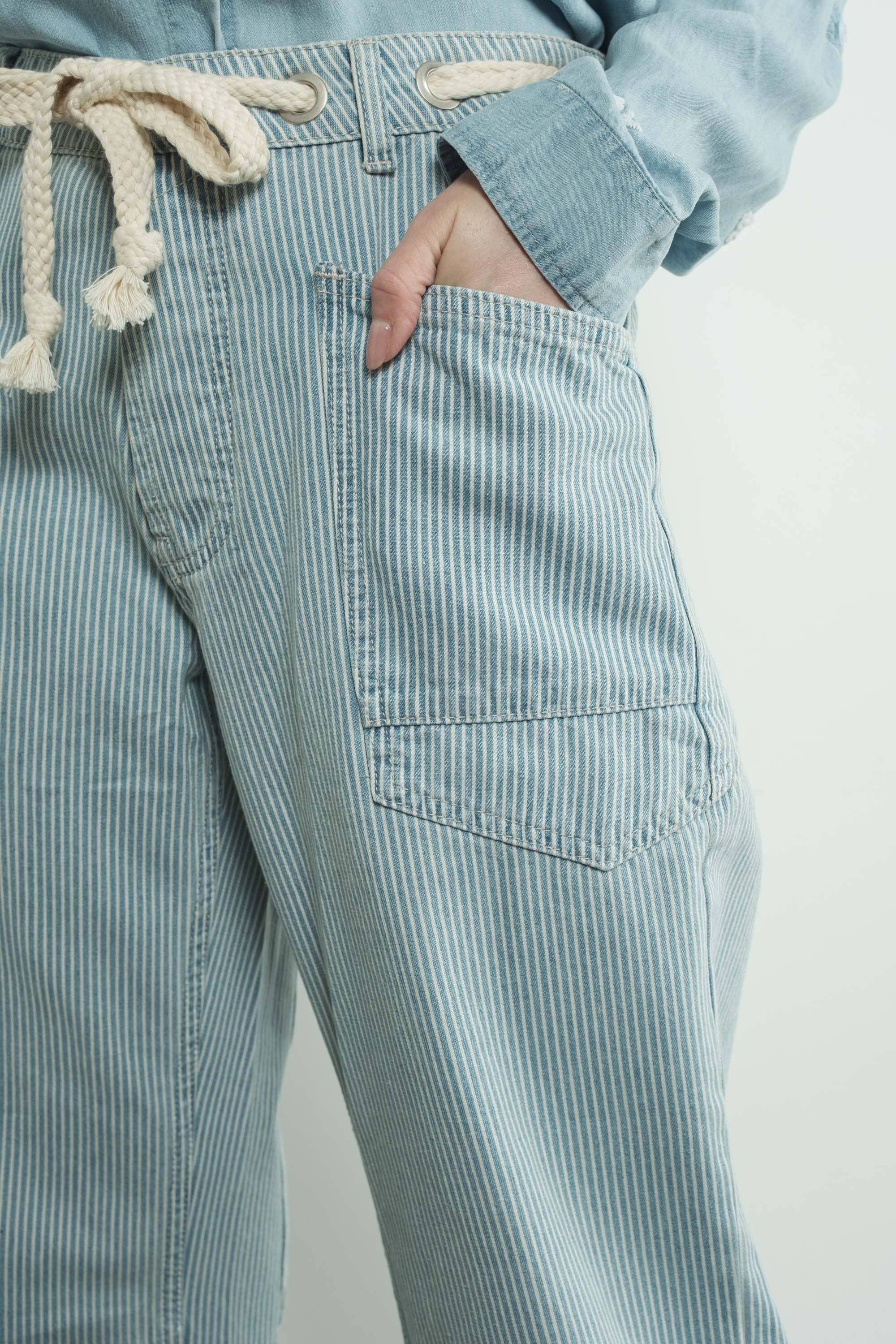 Light blue striped pants with a white background