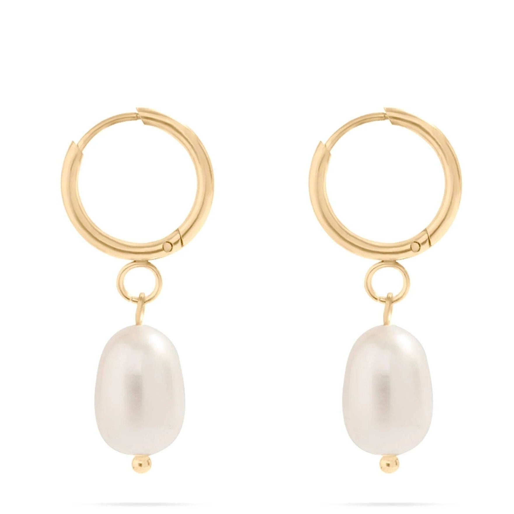 Gold hoop earrings with pearl drops on a white background