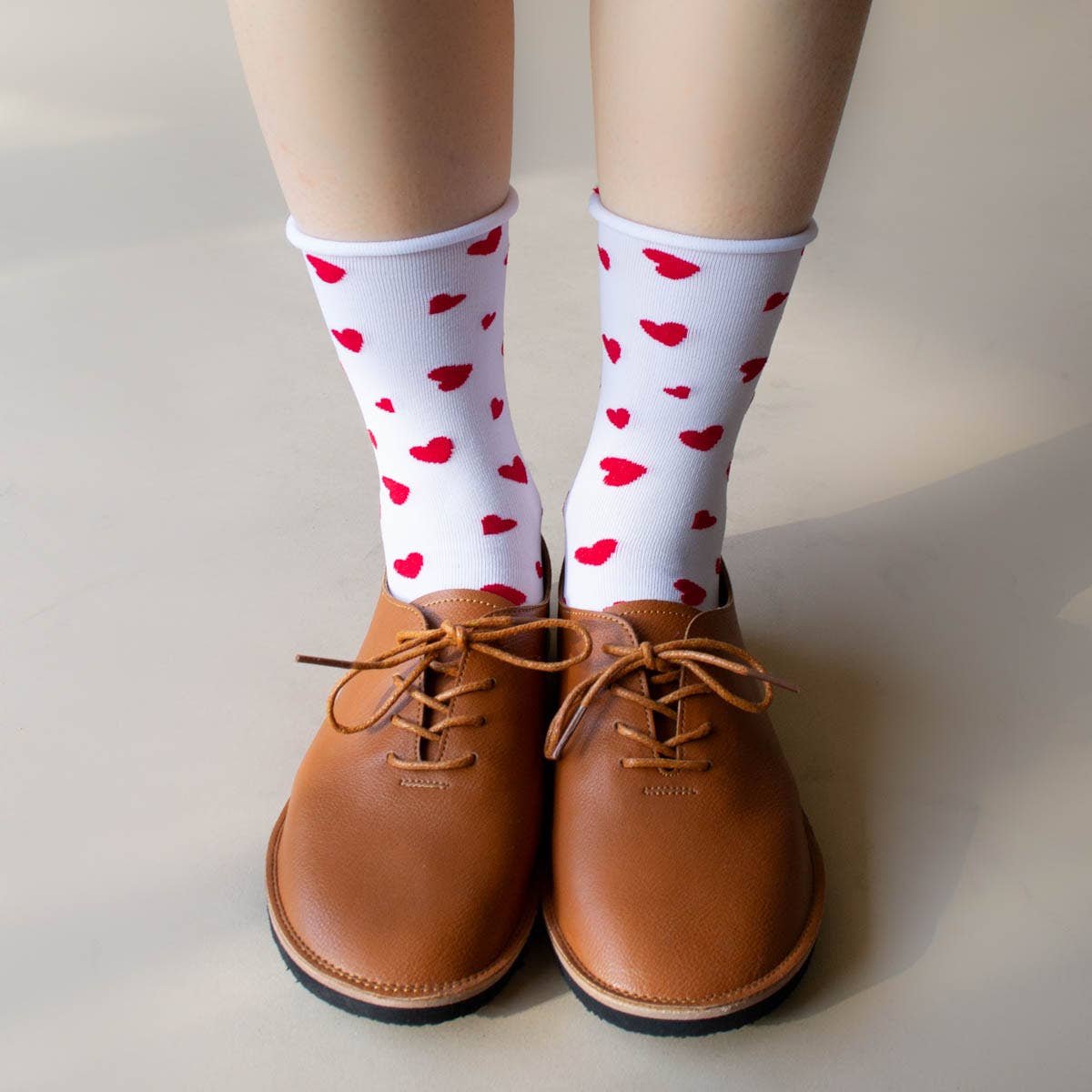 model wearing white socks with red hearts 