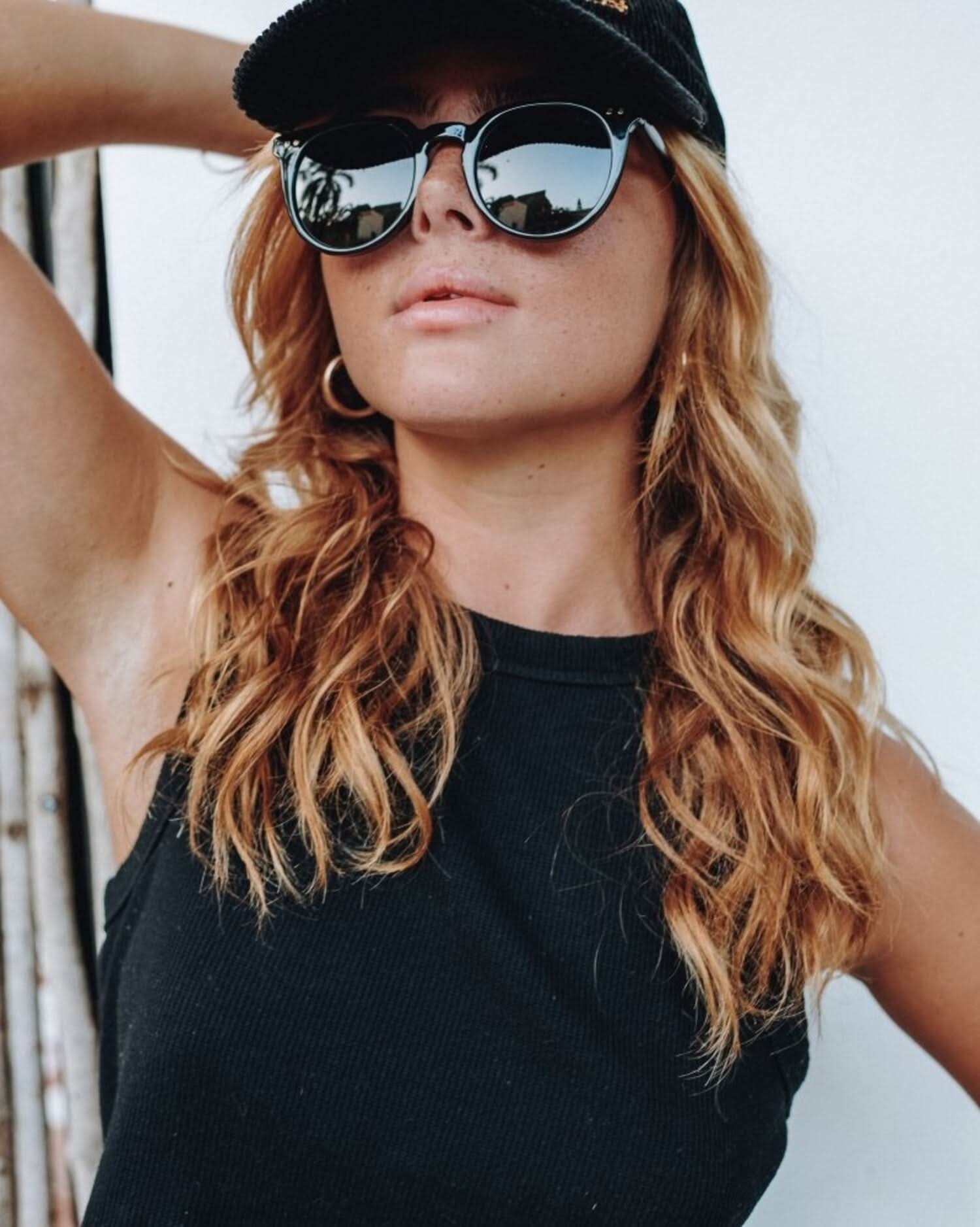 Woman wearing black polarized sunglasses