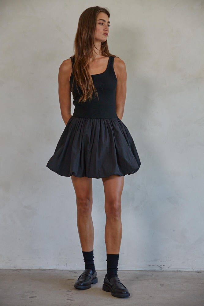 Aster Mini Skort Dress Woman wearing a black sleeveless 