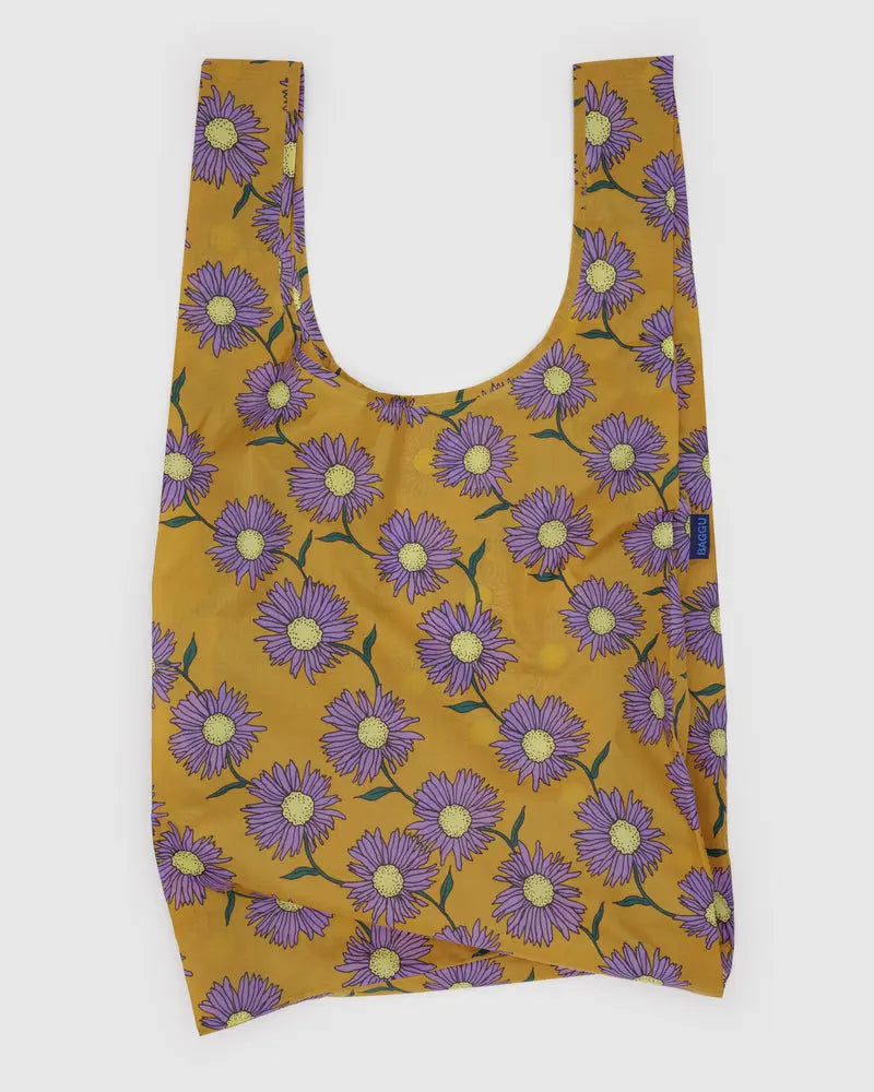 BAGGU Big Bag Reusable bag with purple flower pattern on a mustard yellow background