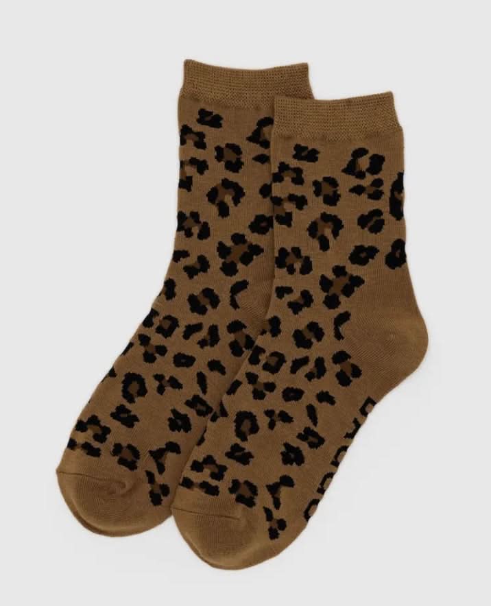 Brown socks with black leopard print on a white background