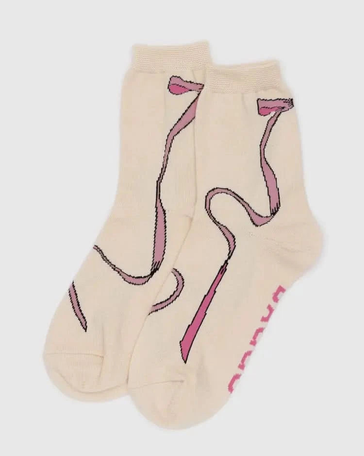 Beige socks with pink flamingo design on a white background