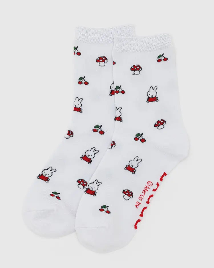 White socks with red and black designs on a white background