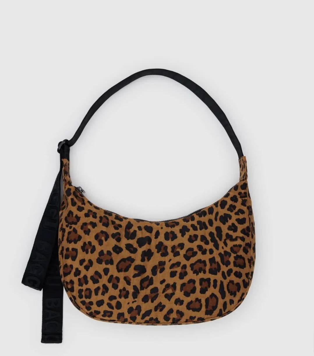 BAGGU leopard print purse with black strap laying flat on a white background 