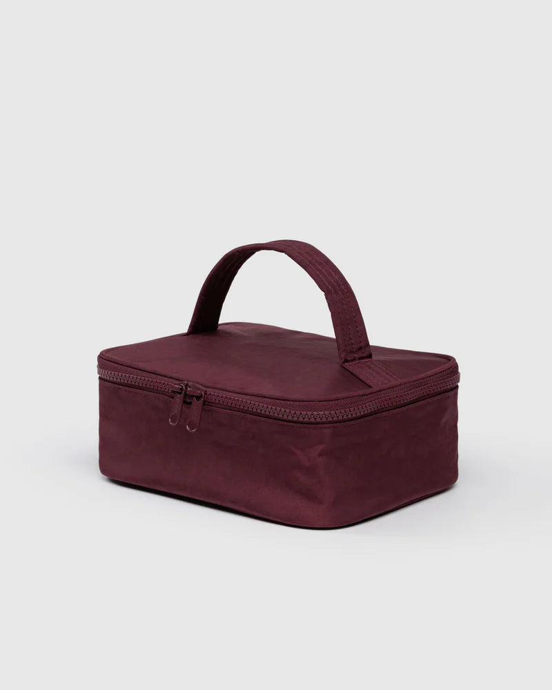BAGGU-Small-Cosmetic-Case-Maroon travel bag with a handle on a light gray background