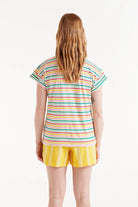 Woman wearing multi-stripe stripped t-shirt and yellow shorts 