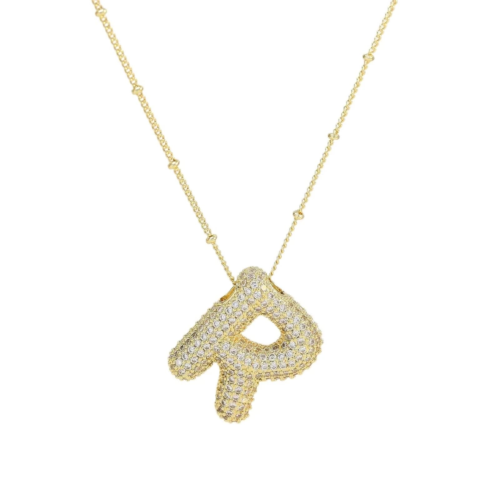 Gold necklace with a letter 'R' pendant on a white background